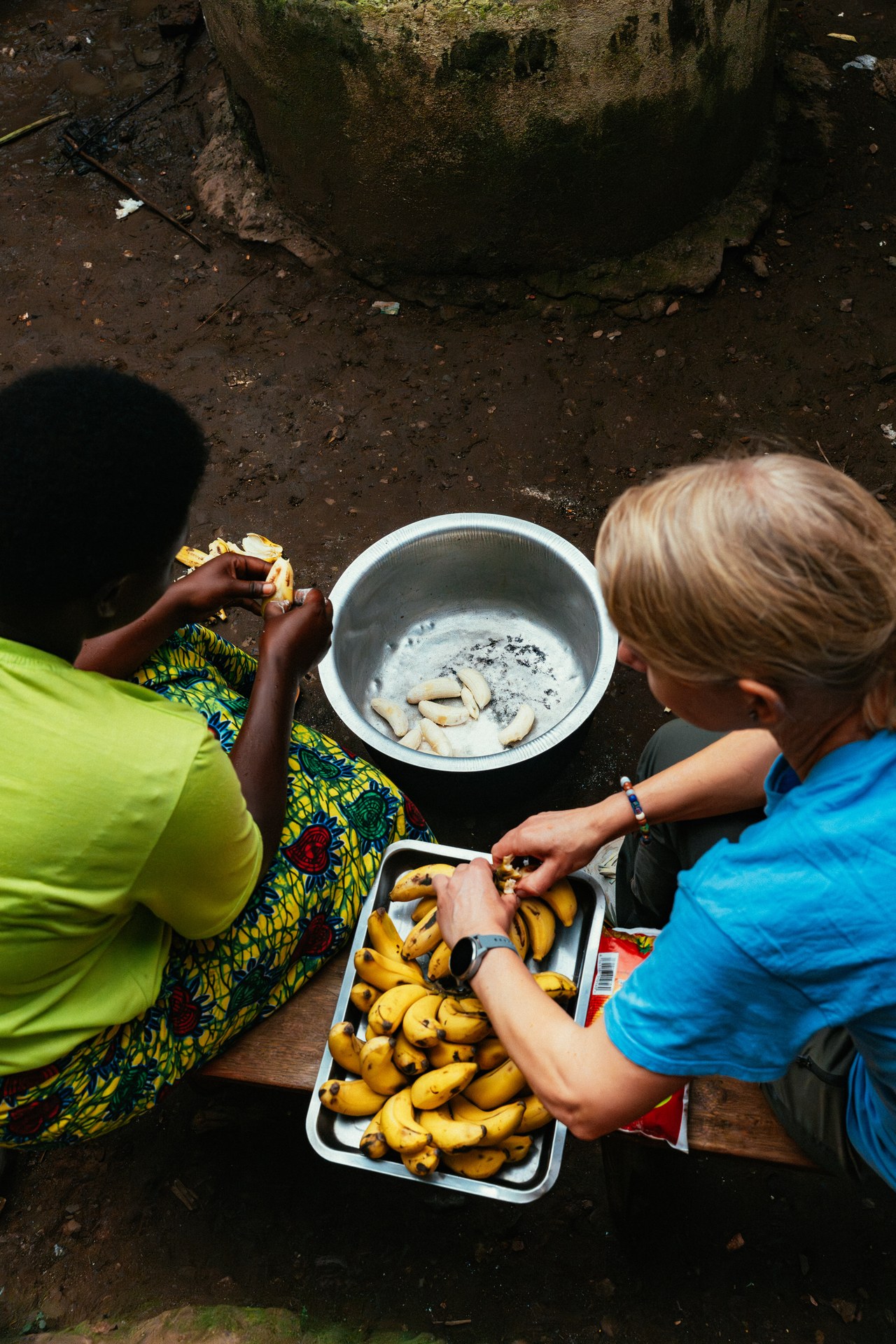 Peeling bananas together at Buhoma orphanage