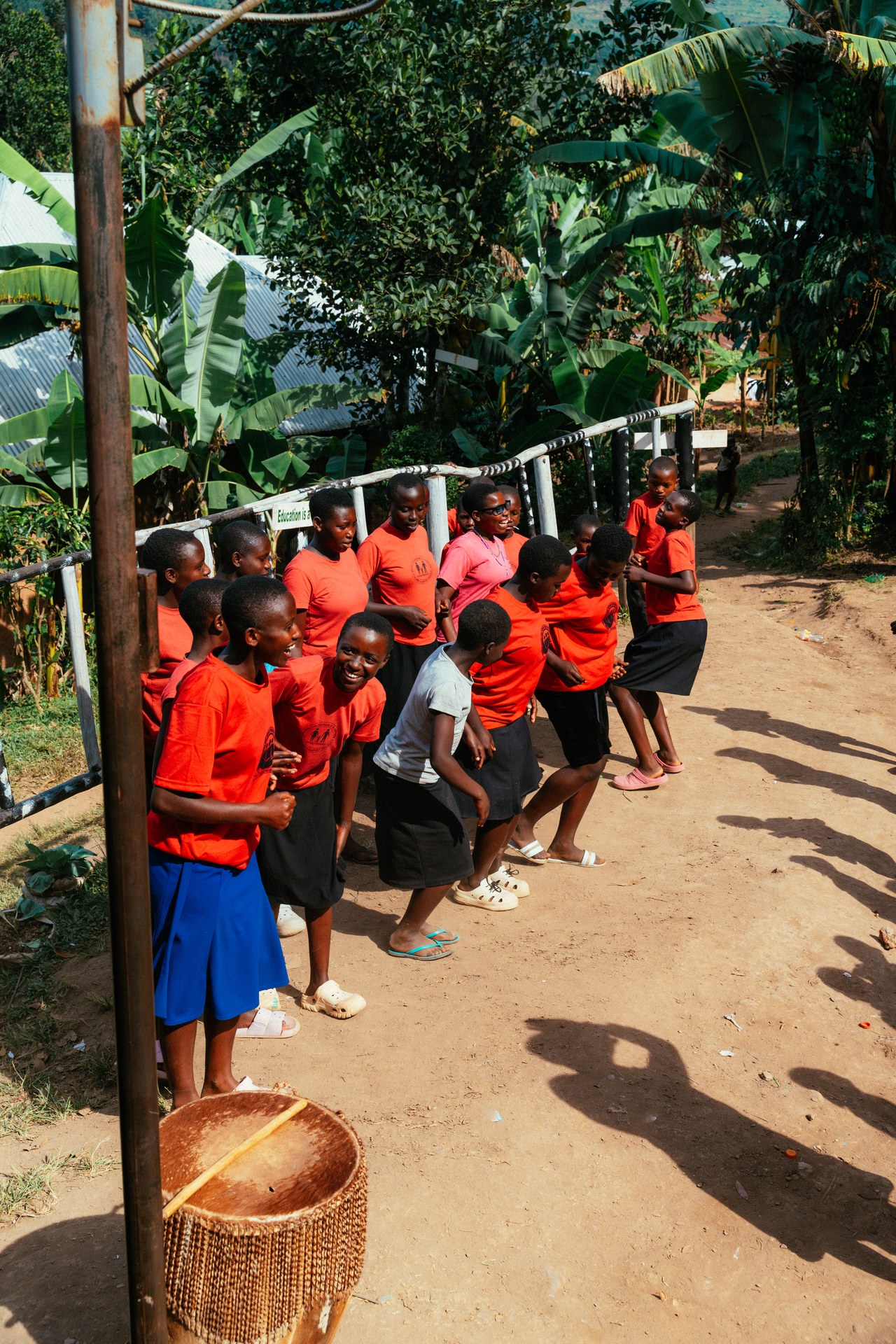 Girls dancing in front of the orphanage in Buhoma