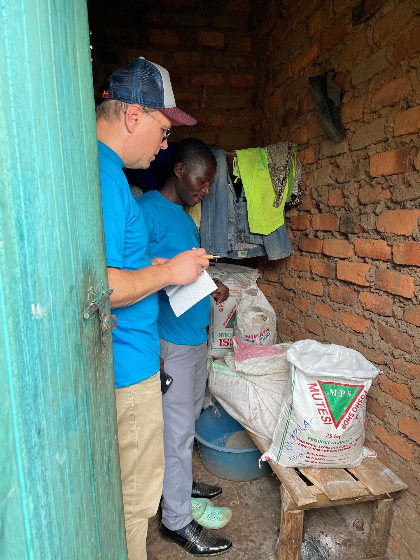 Food storage room at an orphanage in Buhoma, Uganda — a small space with burlap sacks of weekly rations. Photo: Mark Suer, January 2026.