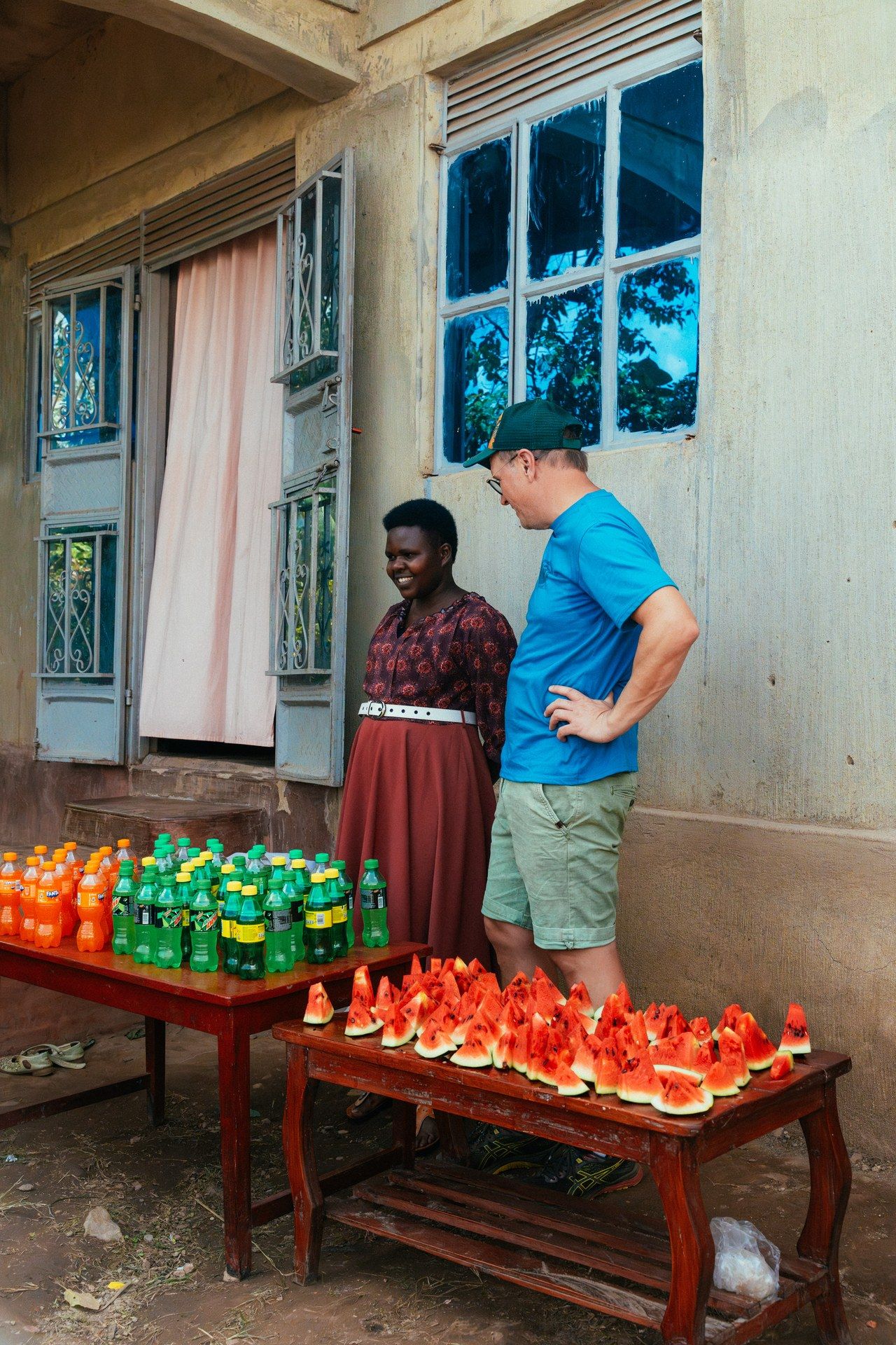 Market encounter in Buhoma, Uganda — local vendors and visitors at a roadside stall