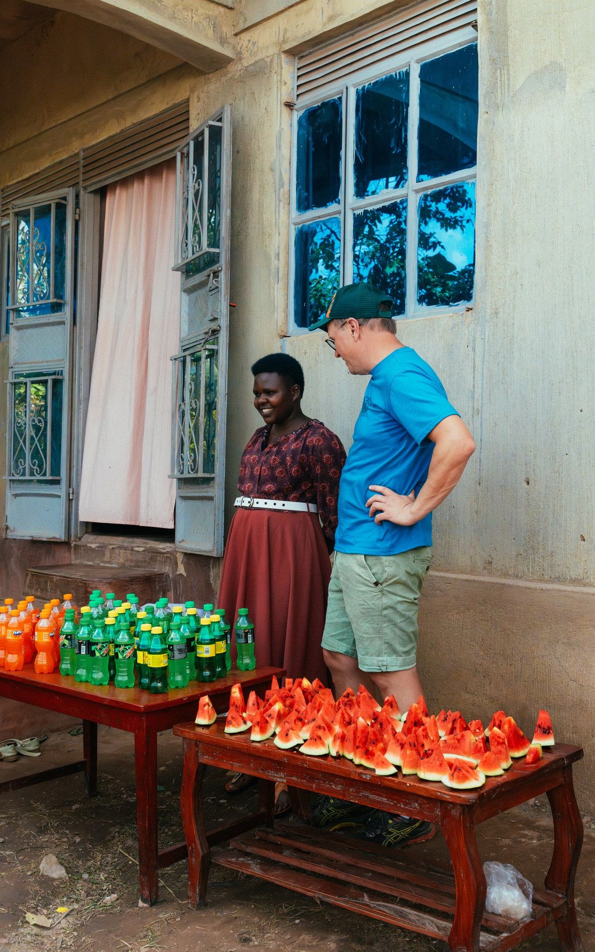 Farewell gathering at Buhoma orphanage — soda and watermelon shared with children and staff, January 2026