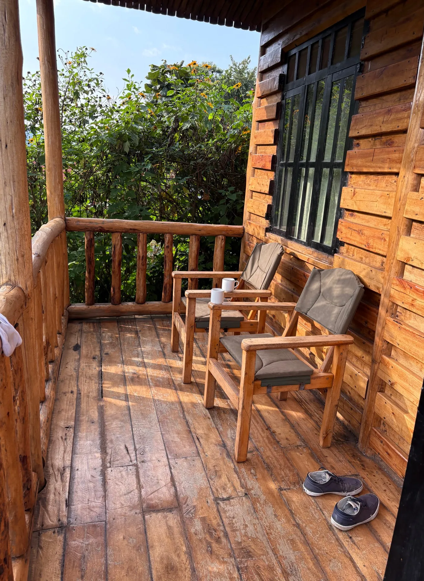 Morning coffee and African tea on the terrace of Gorilla Bluff Lodge, Buhoma, January 2026 — photo by Mark Suer